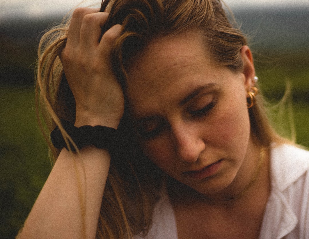 Photo by BĀBI woman in white tank top